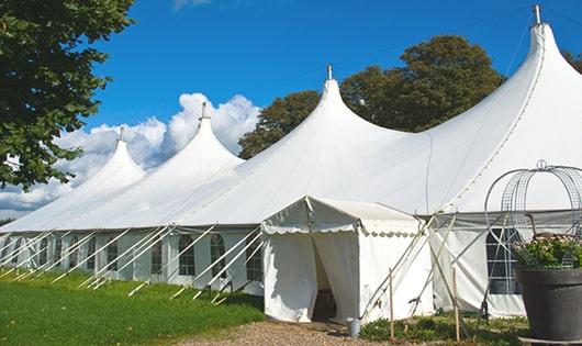 a group of luxury portable restrooms with individual stalls and running water in Great River